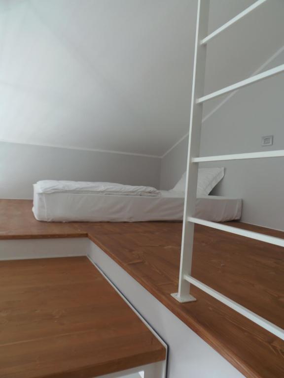 Postel nebo postele na pokoji v ubytování Albergo Dongo