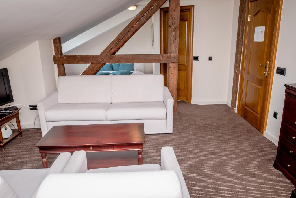 Postel nebo postele na pokoji v ubytování Hotel Astoria