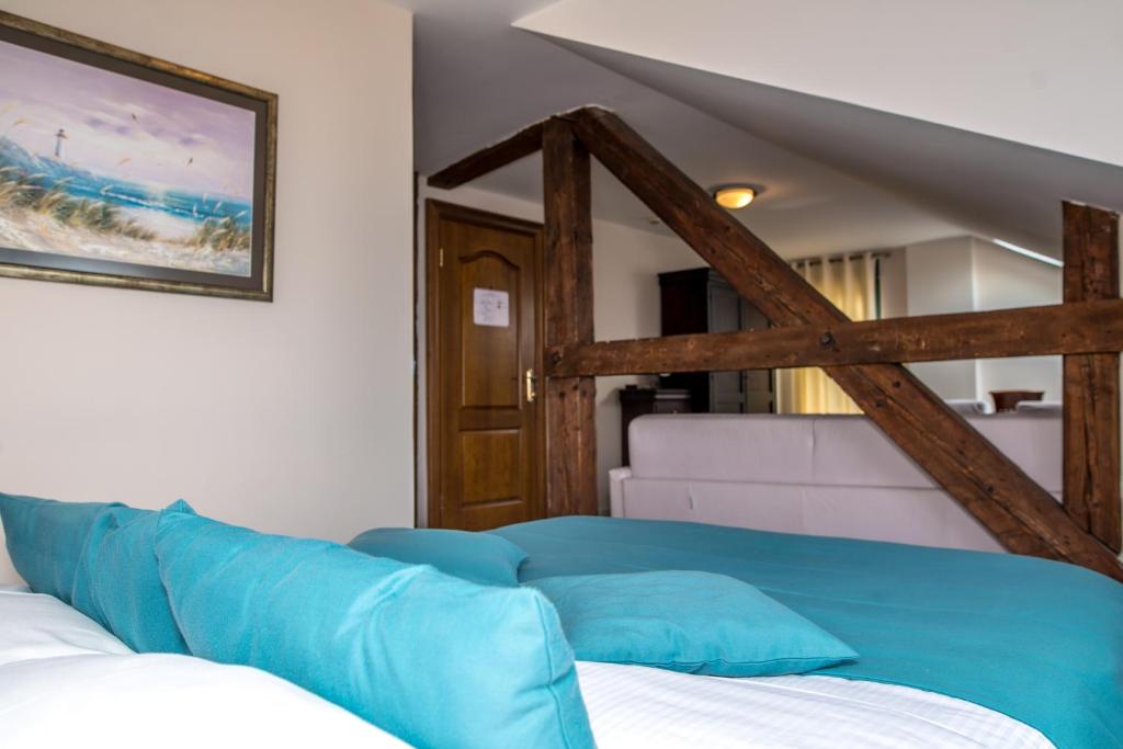 Postel nebo postele na pokoji v ubytování Hotel Astoria