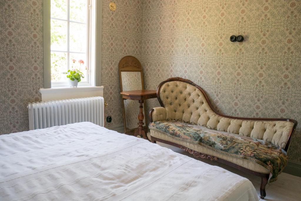Postel nebo postele na pokoji v ubytování Warfsholm