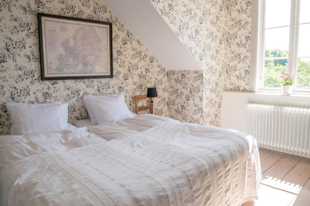 Postel nebo postele na pokoji v ubytování Warfsholm