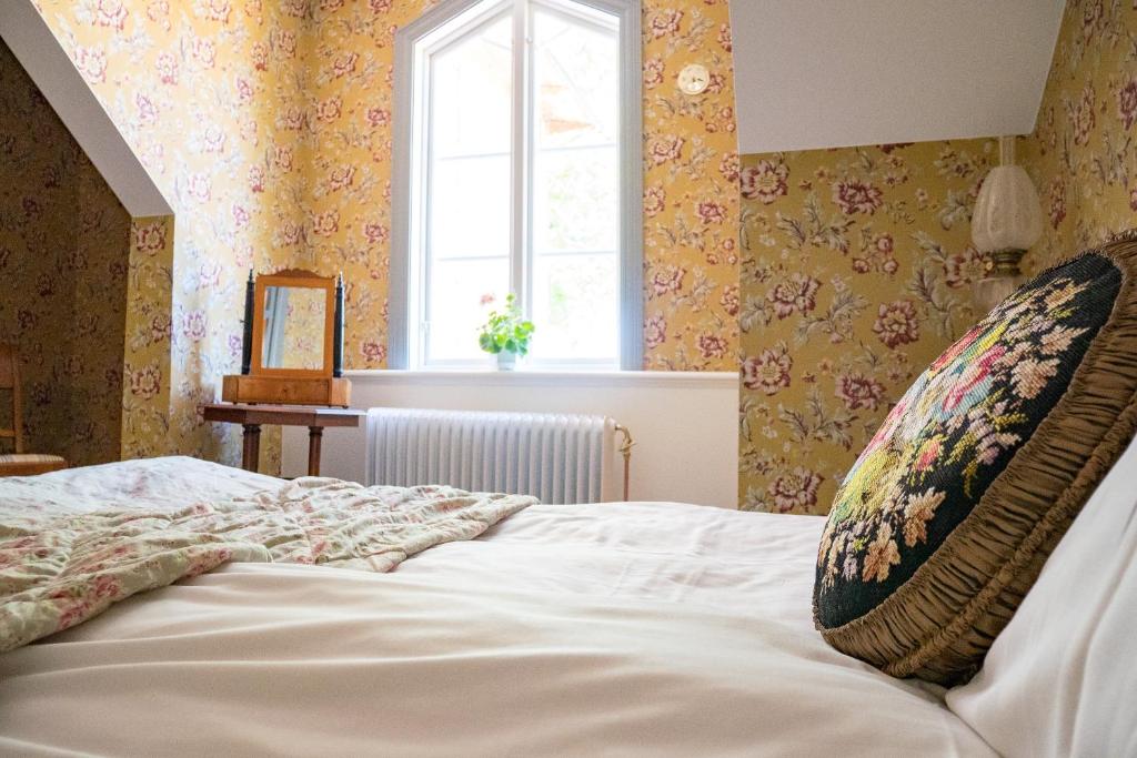 Postel nebo postele na pokoji v ubytování Warfsholm