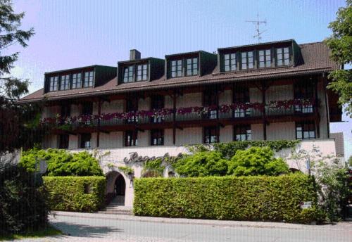 a large building with bushes in front of it at Regerhof in Germering