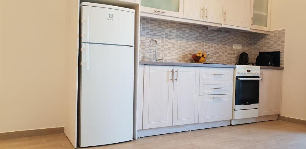Kuchyň nebo kuchyňský kout v ubytování Hibiscus Suites - A