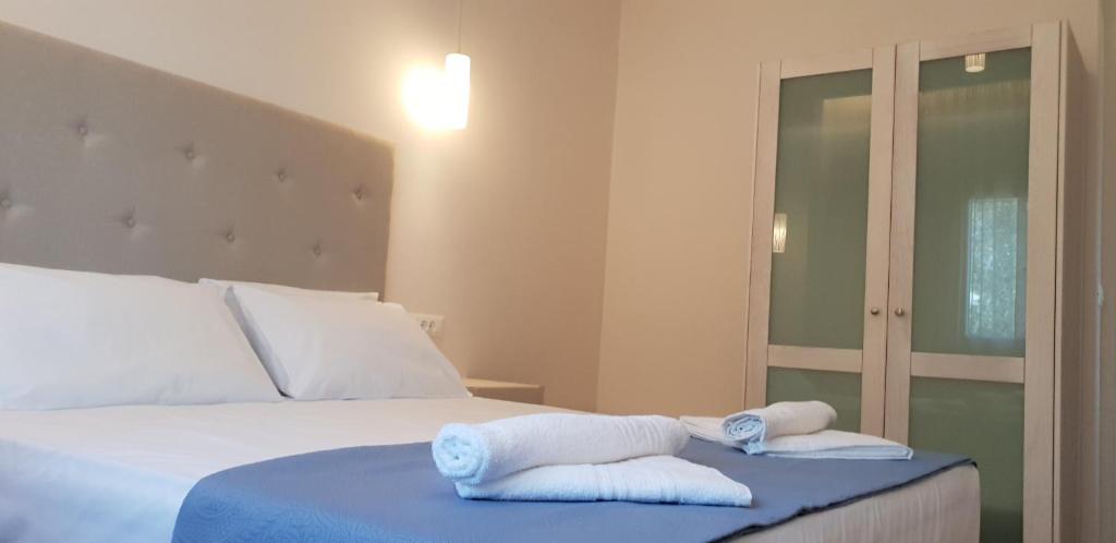 Postel nebo postele na pokoji v ubytování Hibiscus Suites - A
