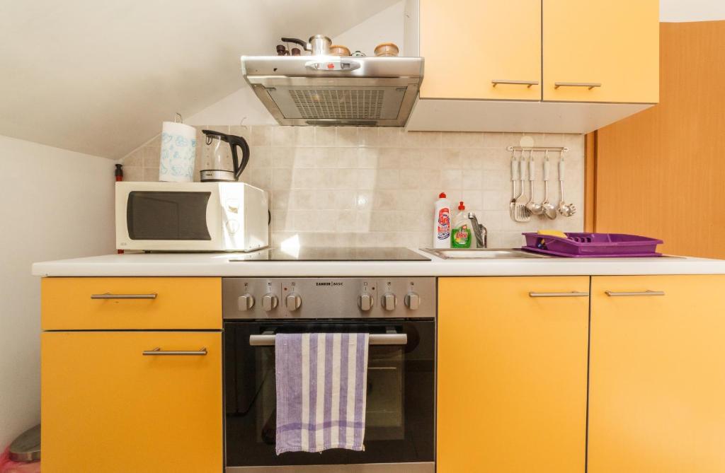 Kuchyň nebo kuchyňský kout v ubytování Apartments Fedrigo