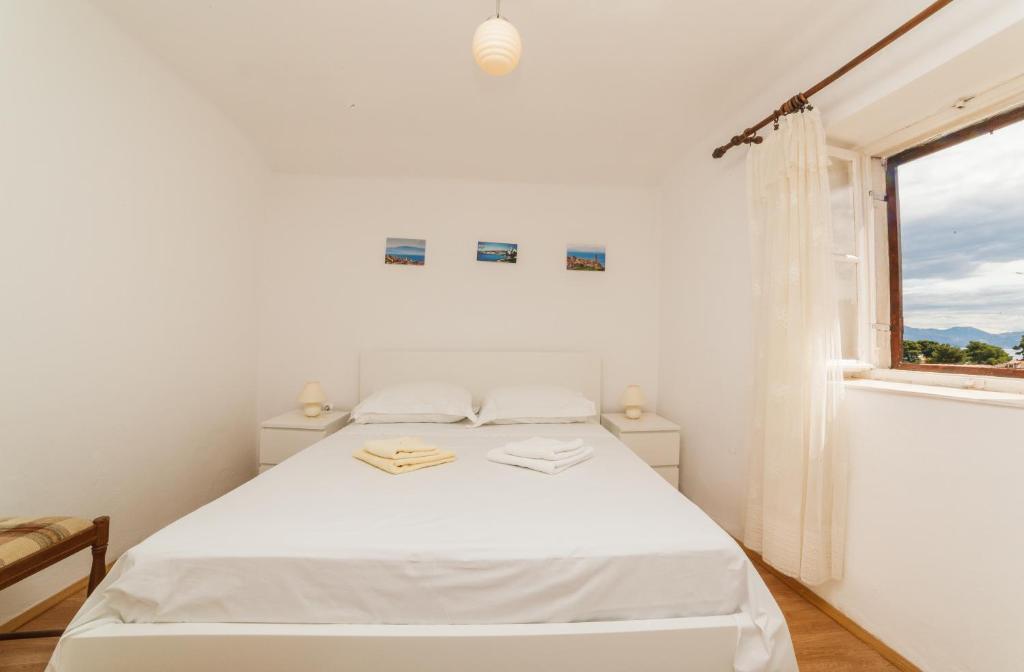 Postel nebo postele na pokoji v ubytování Apartments Fedrigo