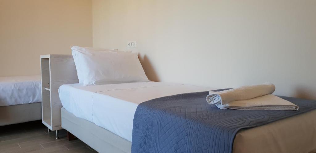 Postel nebo postele na pokoji v ubytování Hibiscus Suites - A