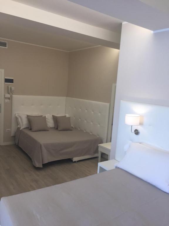 Postel nebo postele na pokoji v ubytování Hotel Ardea