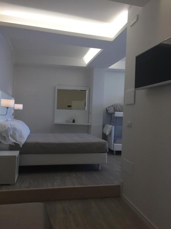 Postel nebo postele na pokoji v ubytování Hotel Ardea