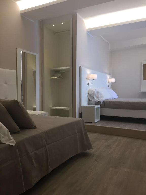 Postel nebo postele na pokoji v ubytování Hotel Ardea