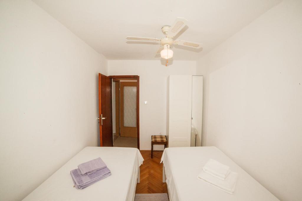 Postel nebo postele na pokoji v ubytování Apartments Fedrigo