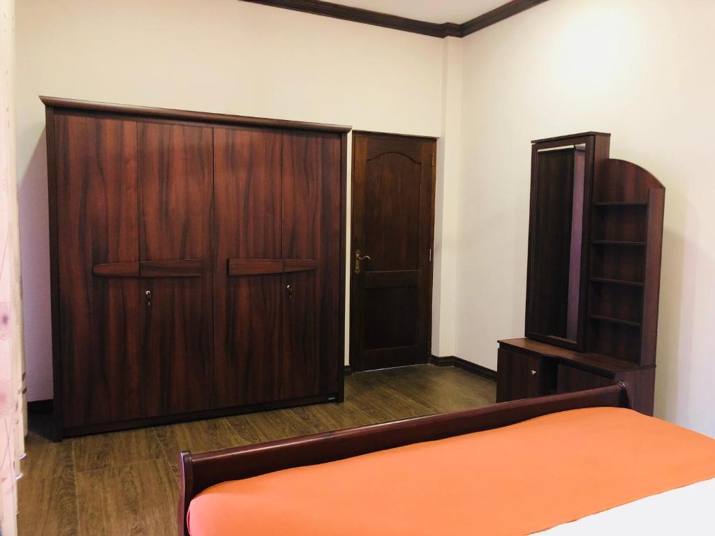 Postel nebo postele na pokoji v ubytování Riverdale Ridge Homestay