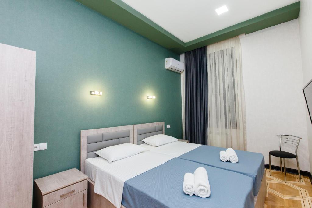 Postel nebo postele na pokoji v ubytování Garden Side Tbilisi