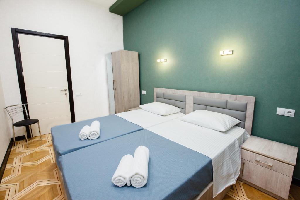 Postel nebo postele na pokoji v ubytování Garden Side Tbilisi