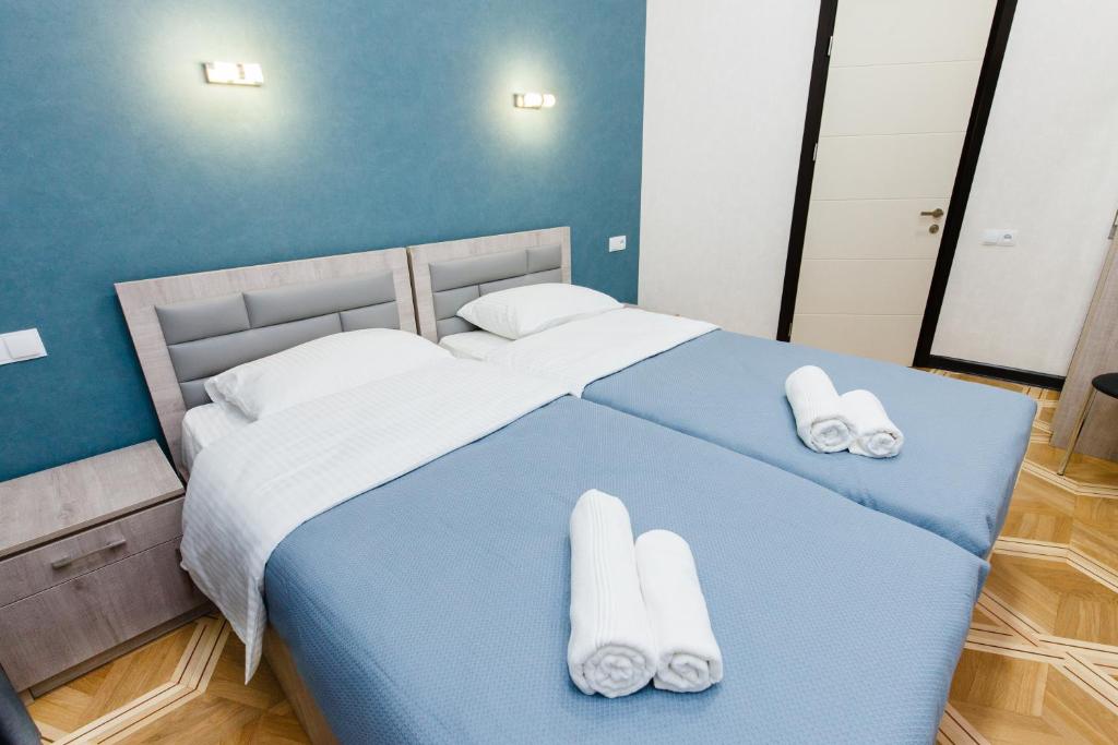 Postel nebo postele na pokoji v ubytování Garden Side Tbilisi