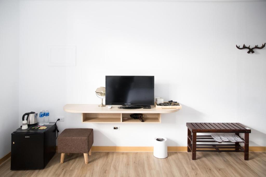 TV a/nebo společenská místnost v ubytování Foresweet B&B
