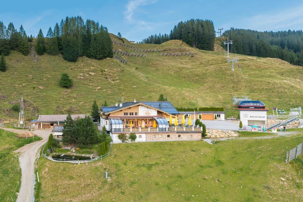 an aerial view of a house on a hill at Gasthof Ochsalm in Kirchberg in Tirol
