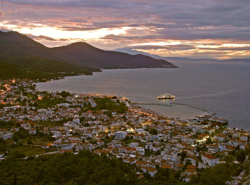 an aerial view of a town on the water at Macedon in Limenas