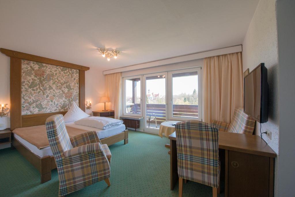 Postel nebo postele na pokoji v ubytování Hotel St. Ulrich Garni