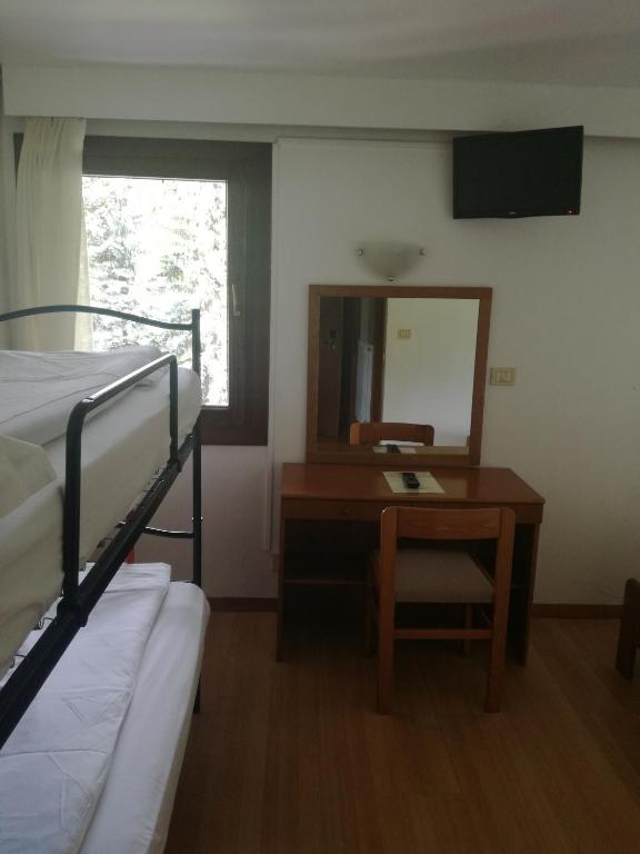 Łóżko lub łóżka w pokoju w obiekcie Park Hotel Miramonti
