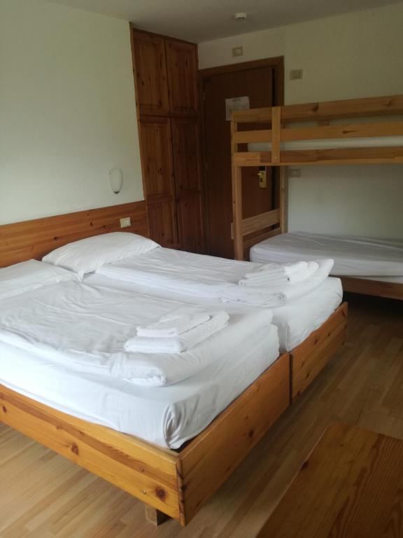 Łóżko lub łóżka w pokoju w obiekcie Park Hotel Miramonti