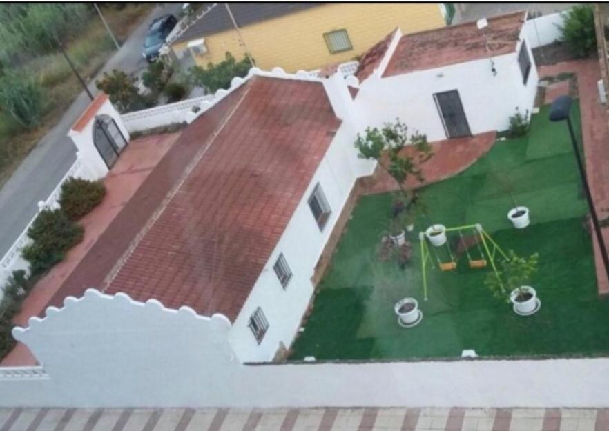 an aerial view of a house with a yard at Casa Natalia in Daimuz