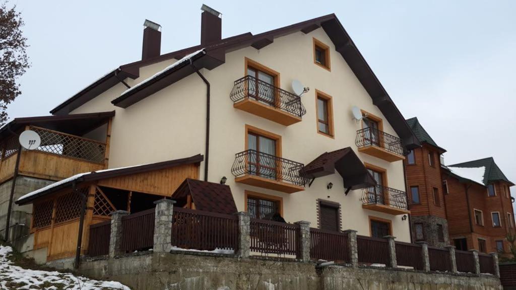 a house with balconies on the side of it at Садиба у Вишкові in Vyshkiv