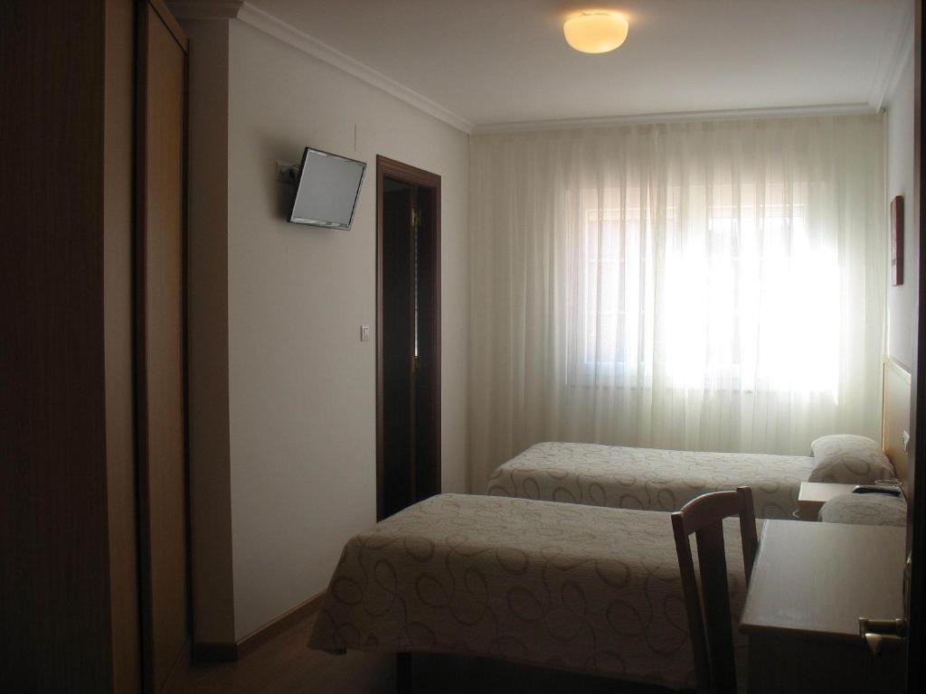 TV a/nebo společenská místnost v ubytování Hotel Reyes De León