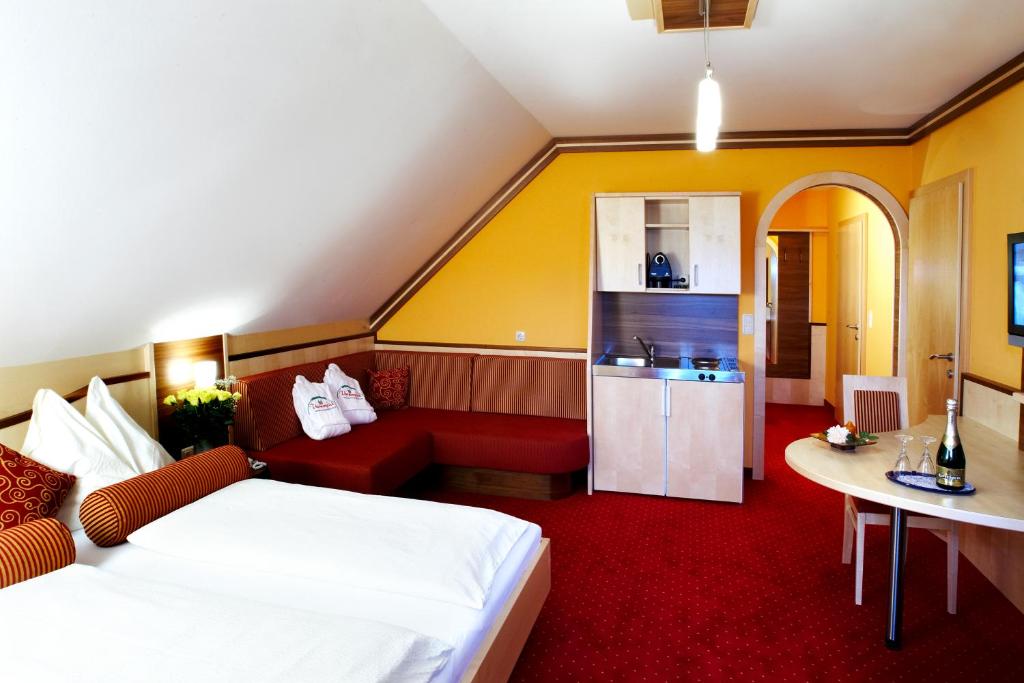 Posteľ alebo postele v izbe v ubytovaní Hotel Garni Thermenglück