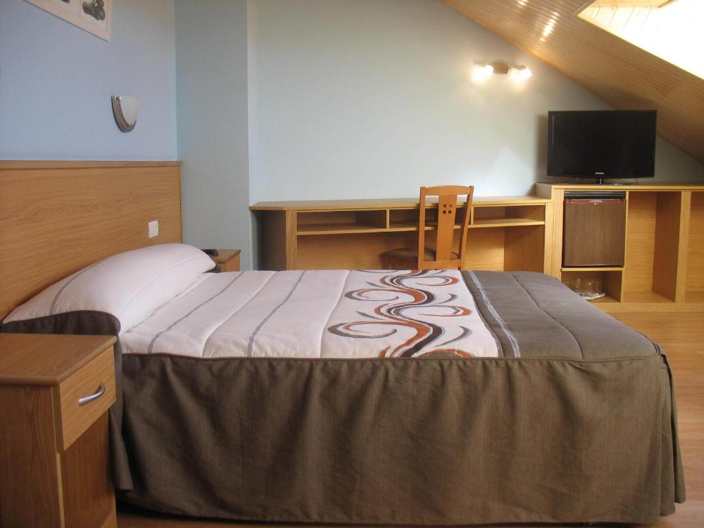 Postel nebo postele na pokoji v ubytování Hotel Reyes De León