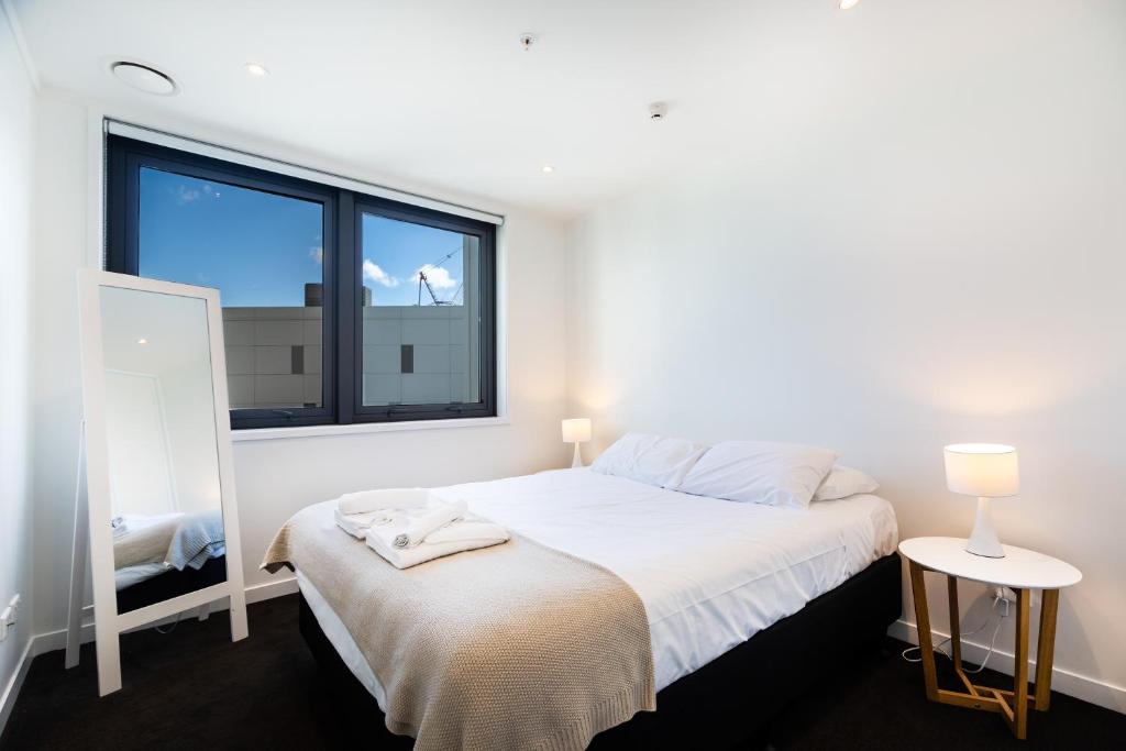 Lova arba lovos apgyvendinimo įstaigoje Brand New Auckland Apartment