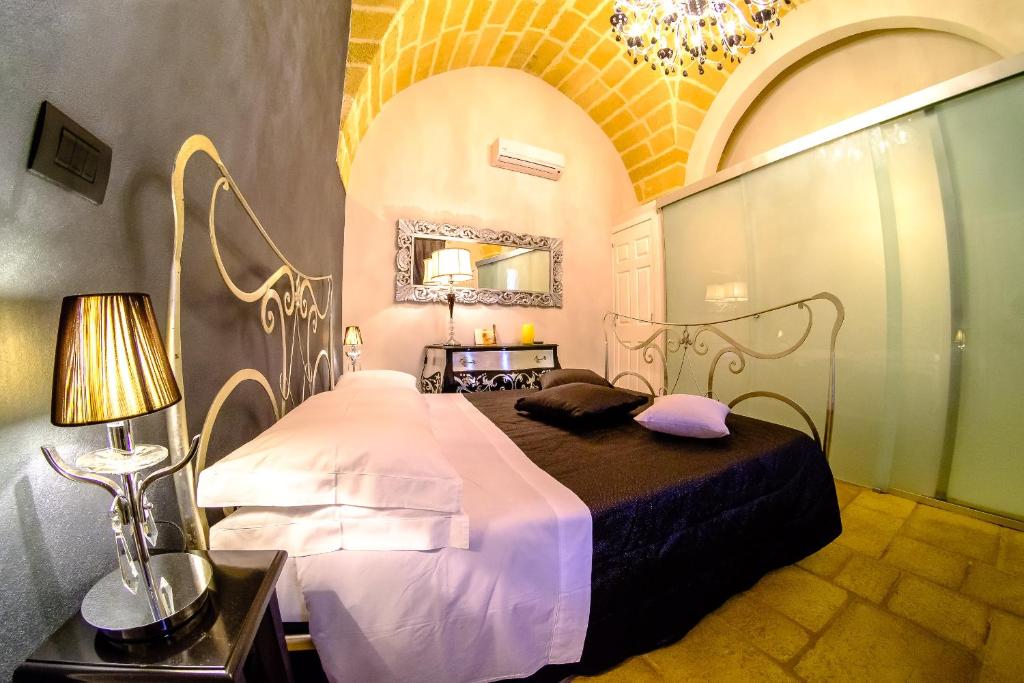 En eller flere senger på et rom på Palazzo Aurora