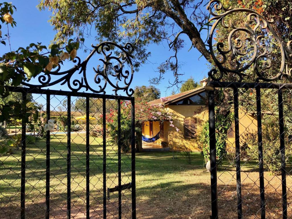 an iron gate in front of a house at Brotas Lodge in Brotas