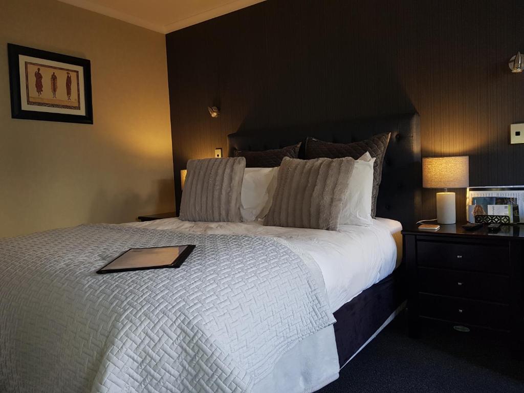 Postel nebo postele na pokoji v ubytování Heta Road B&B