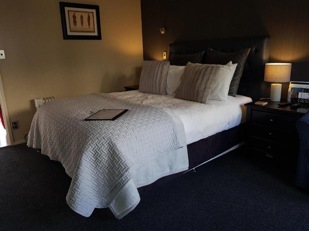 Postel nebo postele na pokoji v ubytování Heta Road B&B