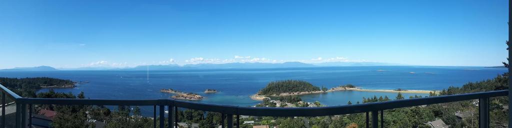 a view of a lake from a balcony at Gibralter Rock Ocean View B&B in Nanaimo