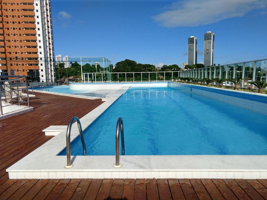 a large swimming pool on top of a building at Essencial Manaíra in João Pessoa