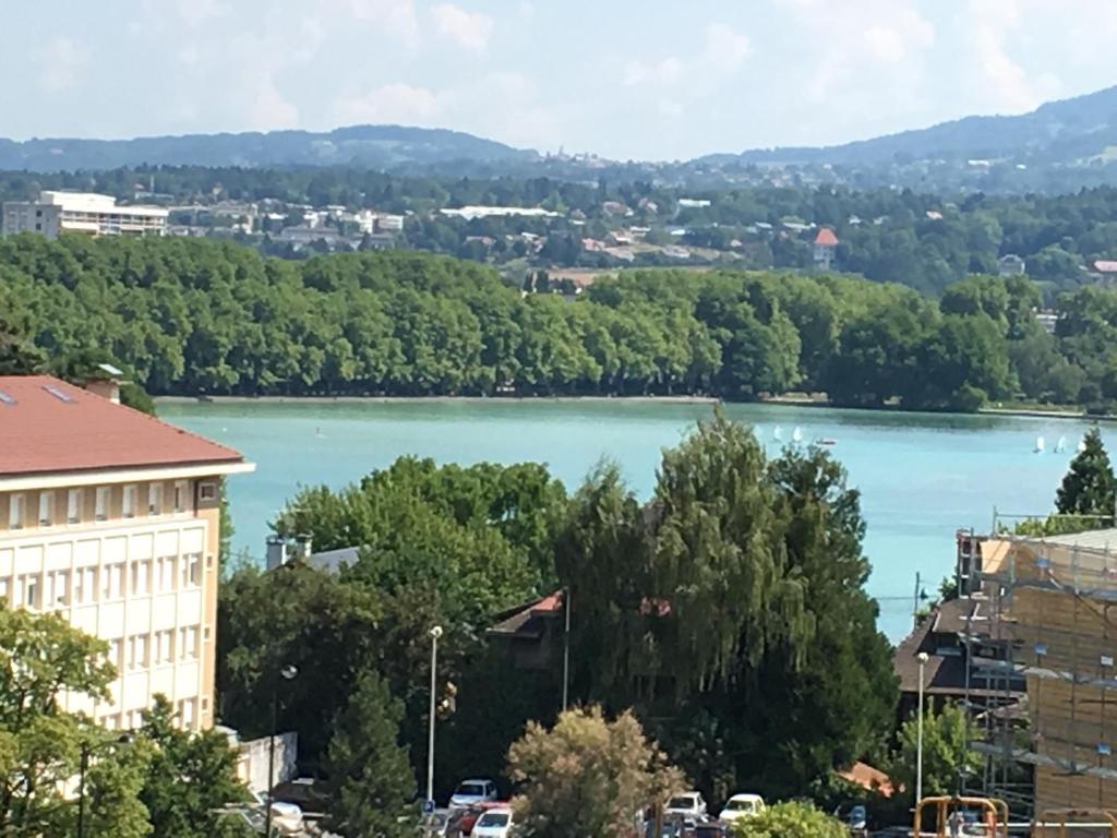 a view of a lake in a city at le Perchoir du Lac in Annecy