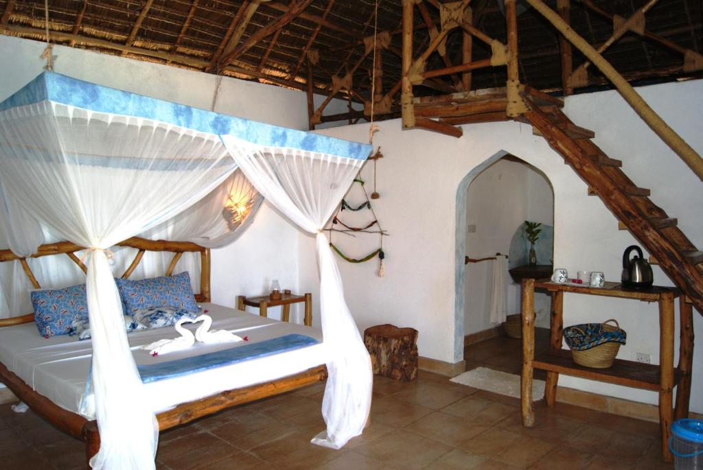 Postel nebo postele na pokoji v ubytování Karamba Eco Boutique Hotel