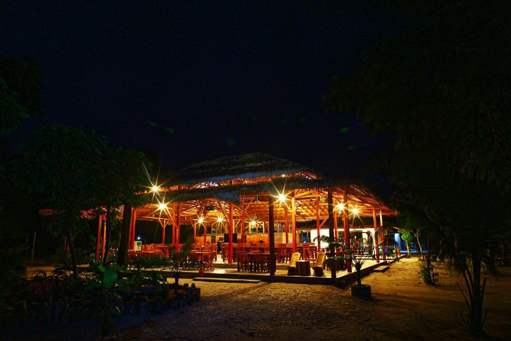 a restaurant at night with lights on it at Leebong Island Resort in Leebong