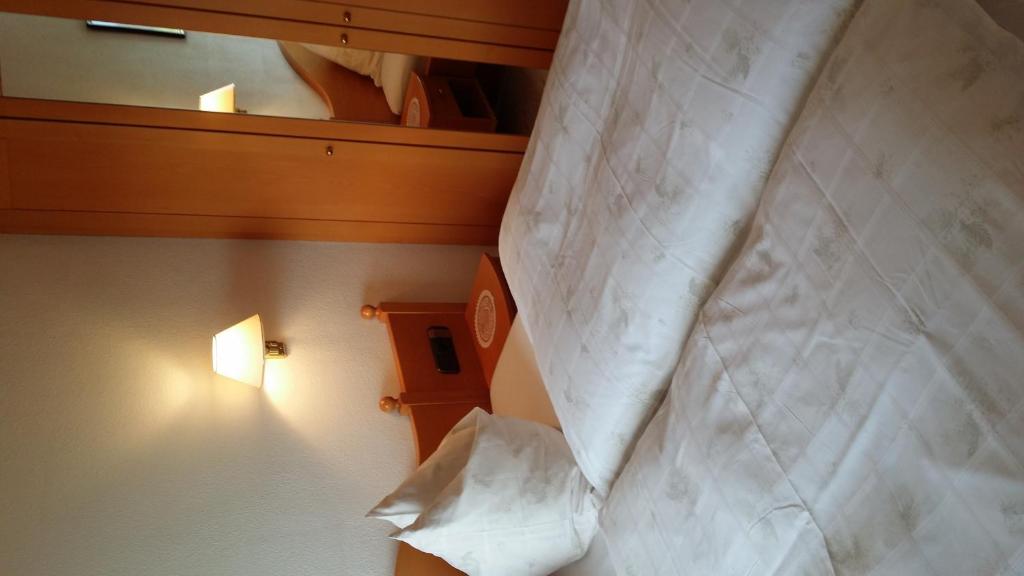 Letto o letti in una camera di KREUZHOF Seefeld