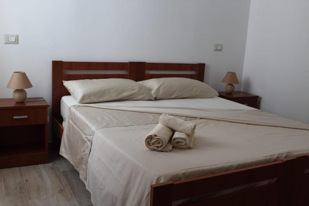 Postel nebo postele na pokoji v ubytování Krasì B&B