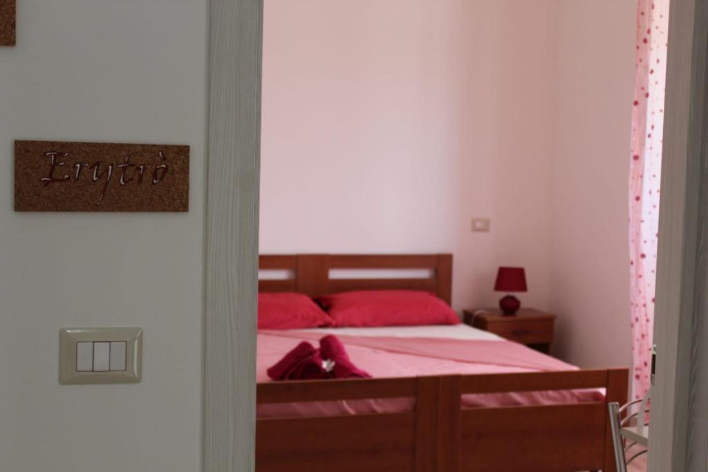 Postel nebo postele na pokoji v ubytování Krasì B&B
