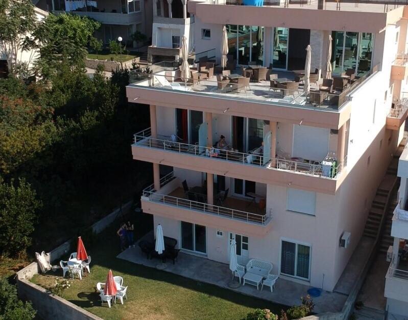 an aerial view of a building with tables and chairs at Casa Hena in Ulcinj