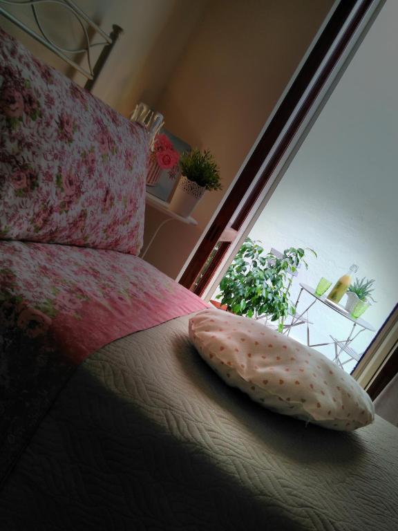 Postel nebo postele na pokoji v ubytování B&B L'angolo fiorito