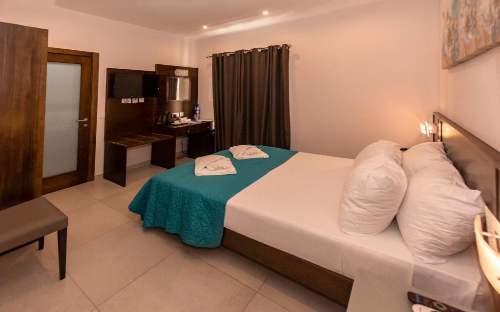 Letto o letti in una camera di Cerviola Hotel