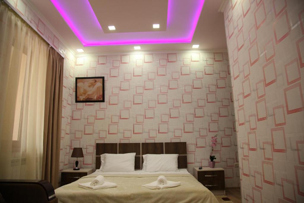 Postel nebo postele na pokoji v ubytování Hotel Felisa Gyumri
