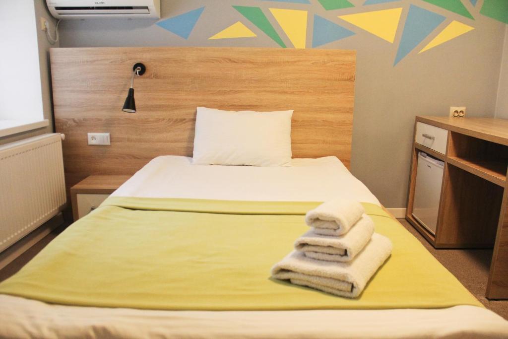 Ліжко або ліжка в номері Blum Hotel