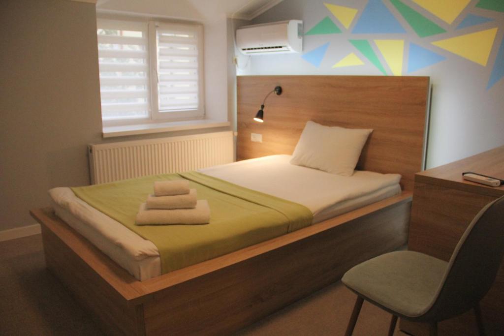 Ліжко або ліжка в номері Blum Hotel